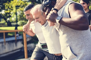 Men assisting an elderly