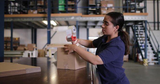 Female working in packing warehouse