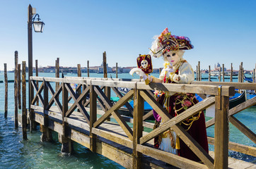 Venice carneval mask leaning on a bridge - Powered by Adobe