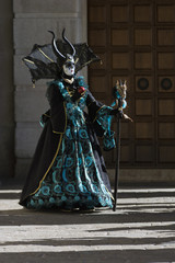 Fototapeta na wymiar Venice carneval dark mask with apple