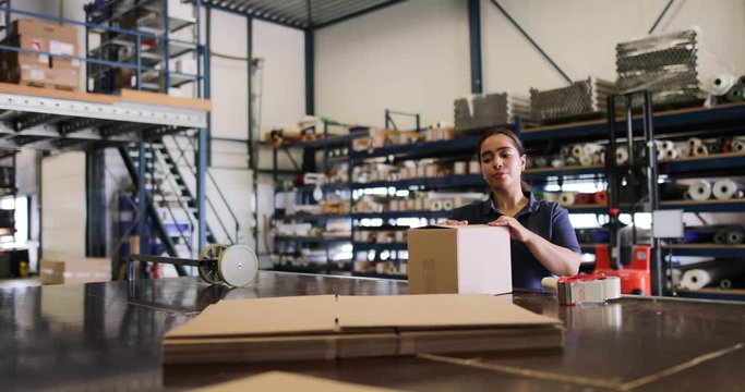 Female working in packing warehouse