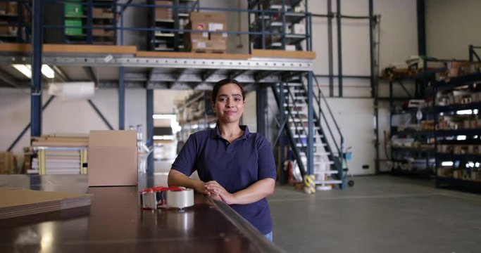 Portrait of female working in packing warehouse