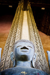 View from below of ancient Buddha statue