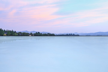 Empty square floor and hill silhouette at dusk