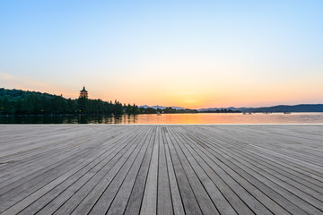 Empty wooden floor and hill silhouette in Hangzhou