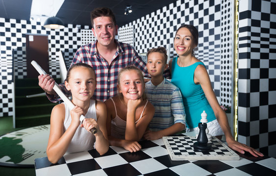 Parents with their children are satisfied after visit of escape room