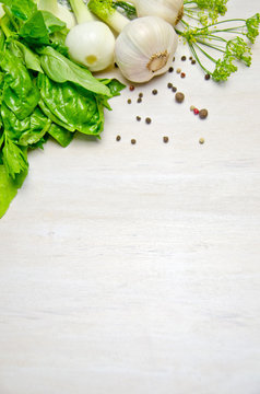 background for menu, Basil leaves garlic and onion and dill pepper peas on wooden white background 