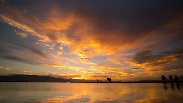 Time lapse of colorful summer sunset over Utah Lake in Provo Boat Harbor.