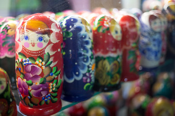 Moscow, Russia - 07 09 2018: a stall selling traditional Russian gifts, nesting dolls, spoons, glass bowls in a shop window.