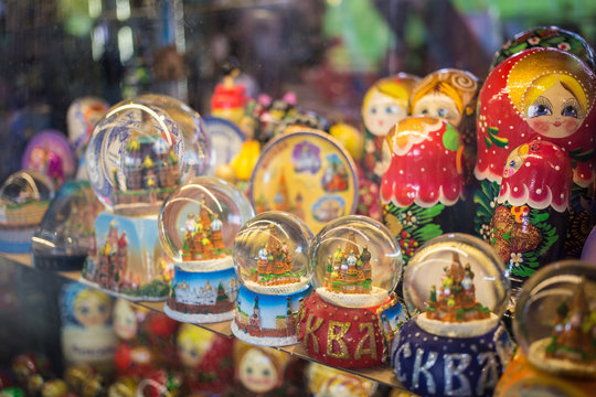 Moscow, Russia - 07 09 2018: a stall selling traditional Russian gifts, nesting dolls, spoons, glass bowls in a shop window