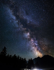 Fototapeta na wymiar Astrophotography of Milky Way galaxy. Silhouette of mountains. Stars, nebula and stardust at night sky landscape