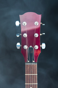 electric guitar head in smoke