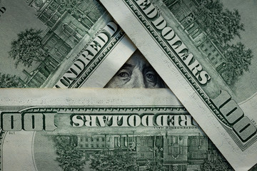 background. hundred-dollar banknotes are lined with a pyramid. Franklin.