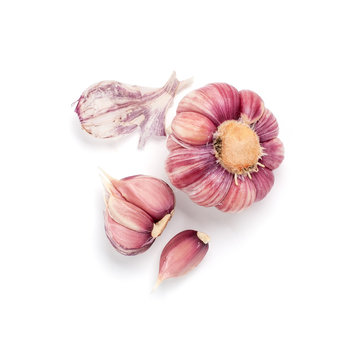 The head of pink garlic and lobules without skin on a white background..