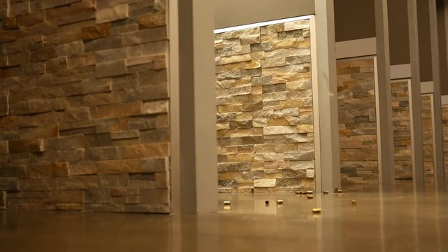 Bullet casings fall from a weapon being fires at a gun firing range