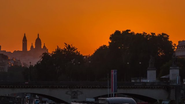 Sunrise with Basilica Sacre Coeur and the Seine river timelapse, Paris, France.