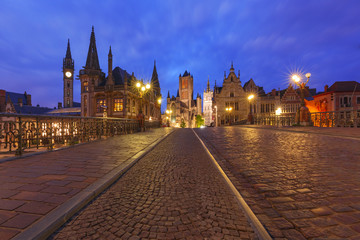 Fototapeta na wymiar Picturesque medieval building and St. Michael's Bridge at night in Ghent, Belgium