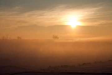 Countryside winter landscape at sunset
