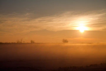 Countryside winter landscape at sunset
