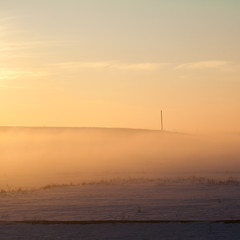 Countryside winter landscape at sunset
