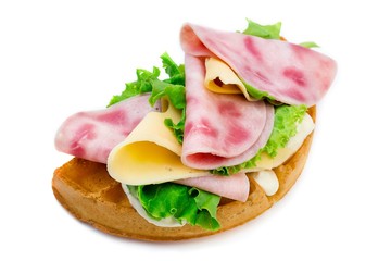 Belgium waffle with ham, lettuce and chease isolated on white background