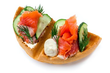Belgium waffle with salmon, dill and cucumber isolated on white background