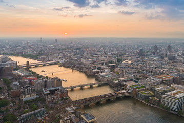 London city with Thames river and its bridges at sunset, in United Kingdom