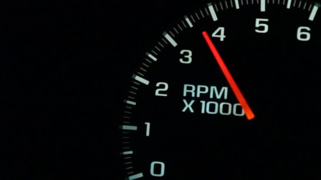 A Car or trucks dashboard RPM Gauge revs up from an idle at 500 up to 6000 and back down again.