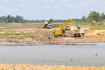 backhoe to excavate the soil on the ground.construction site excavator.wheel loader,backhoe...