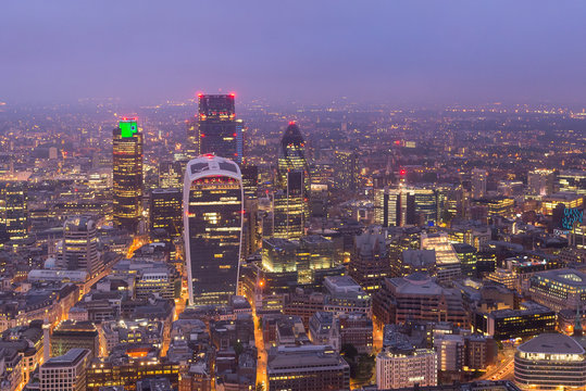 London financial centre at sunset, seen from a skyscraper in London centre, in United Kingdom