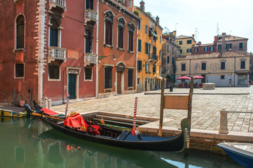 Fototapeta na wymiar Gondola parked at small piazza, Venice