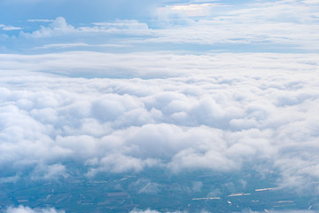 Fototapeta na wymiar Big Blue sky and Cloud and city under cloud Top view from airplane window,Nature background.