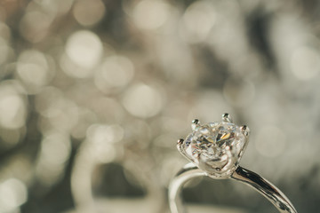 luxury engagement Diamond ring with abstract bokeh light background