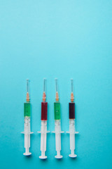 syringe on blue background.