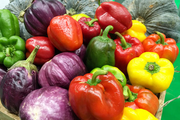Colorful bell peppers.Fresh Red Yellow and Green sweet pepper into the basket.