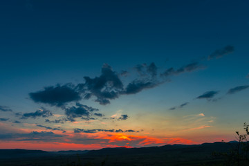 Obraz premium Dramatic Clouds at the sunsdet