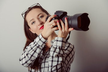 Obraz premium Woman-photographer takes images,