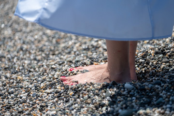 woman feet on the beach