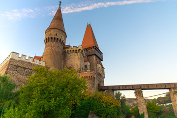 Obraz premium Old medieval castle in the morning at the sunrise, Corvinesti Castle, Romania