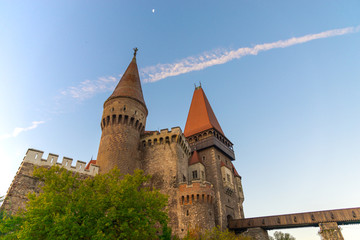 Fototapeta na wymiar Old medieval castle in the morning at the sunrise, Corvinesti Castle, Romania