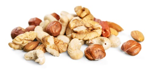Assorted mixed nuts on white background
