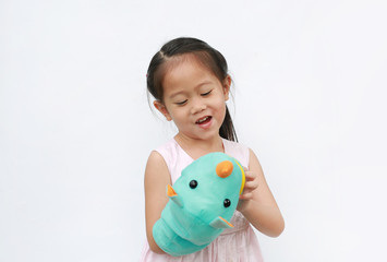 Cute little Asian child girl hand wear and playing Rhinoceros puppets on white background....
