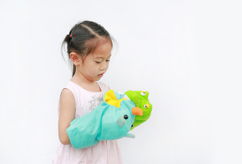 Little Asian child girl hands playing animal puppets on white background. Educations concept.