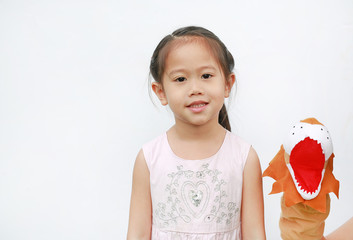 Cute Little Asian child girl hand wear and playing Lion puppets on white background. Educations...