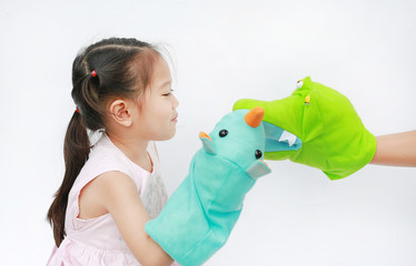 Little Asian child girl hands playing animal puppets on white background. Educations concept.