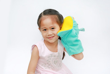 Little Asian child girl hand wear and playing Rhinoceros puppets on white background.