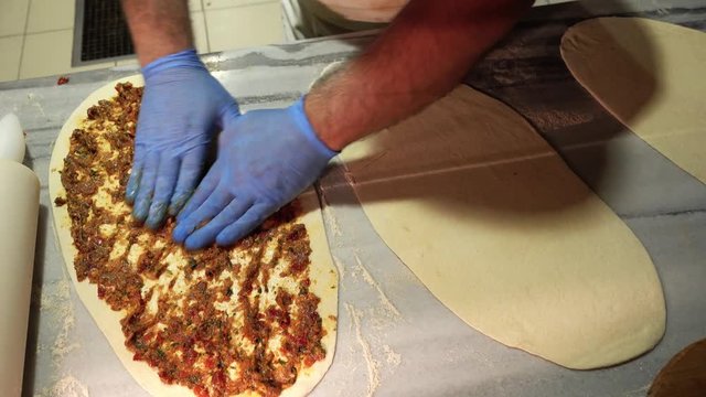  Chef makes meat pide.
