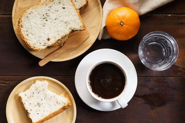 cup of black coffee with bread