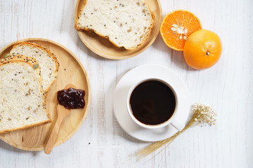 cup of black coffee with bread