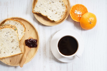 cup of black coffee with bread